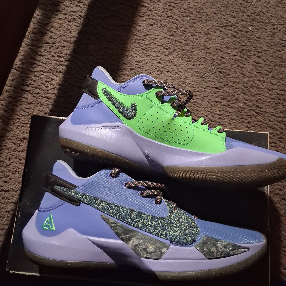 The Greek Freak 4's Nike Vibrant Purple and Green Sneakers
